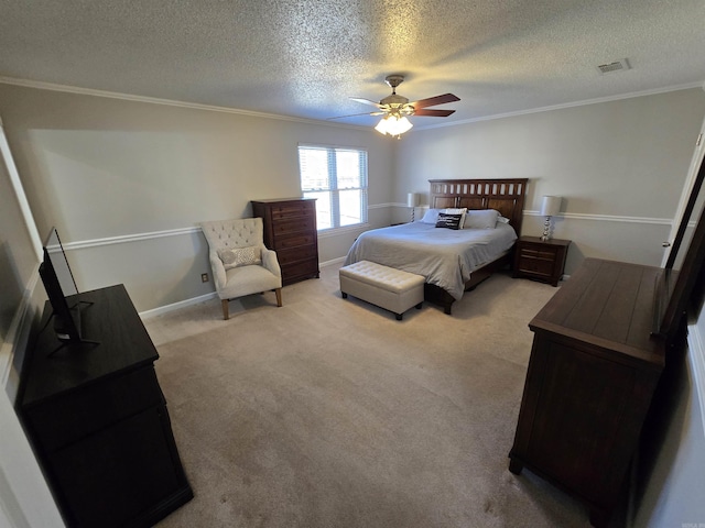 bedroom featuring a ceiling fan, baseboards, visible vents, carpet floors, and ornamental molding