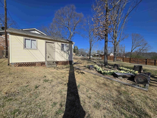 view of yard featuring fence and entry steps