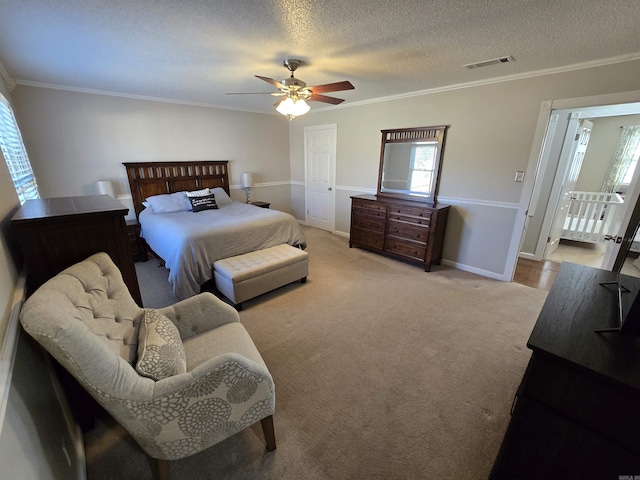 carpeted bedroom featuring crown molding and a textured ceiling