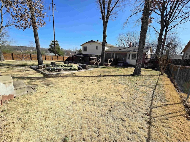 view of yard with a fenced backyard