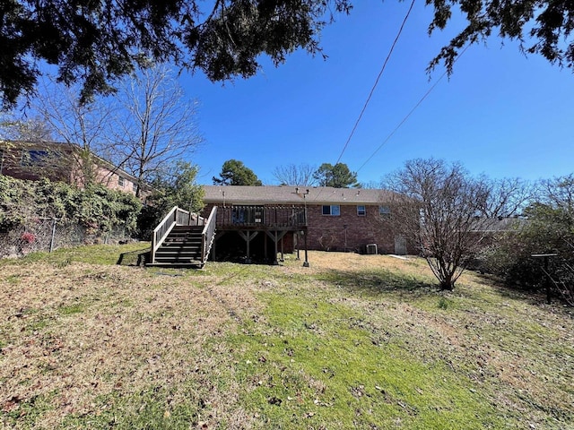 back of property with stairway and a wooden deck