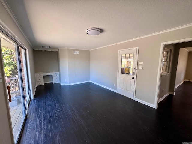 unfurnished living room featuring wood finished floors, visible vents, baseboards, ornamental molding, and a textured ceiling