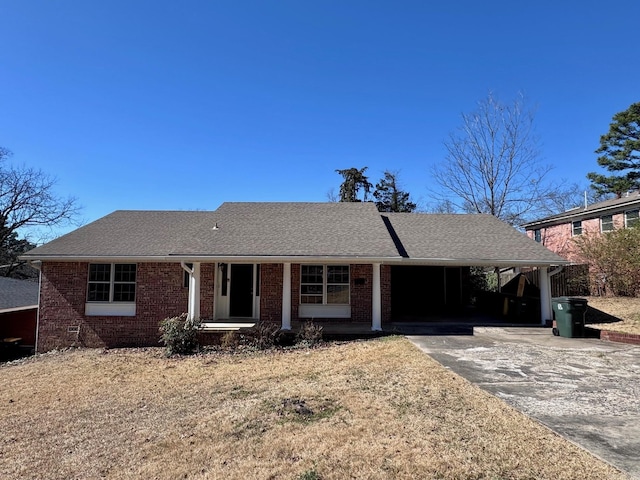 ranch-style house with a carport, driveway, a porch, and brick siding