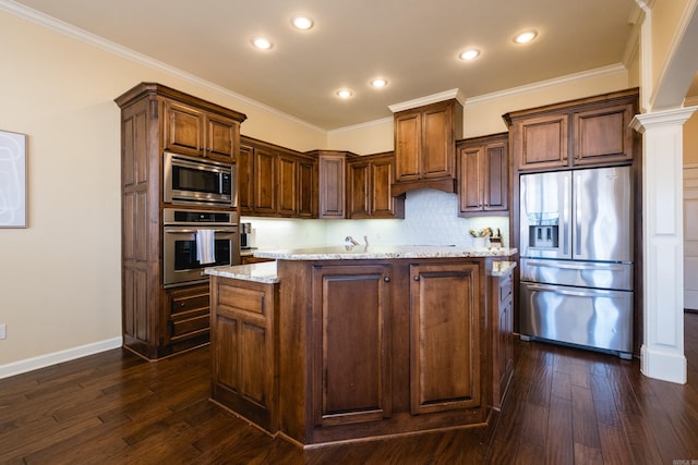 kitchen with light stone countertops, appliances with stainless steel finishes, dark wood finished floors, and crown molding