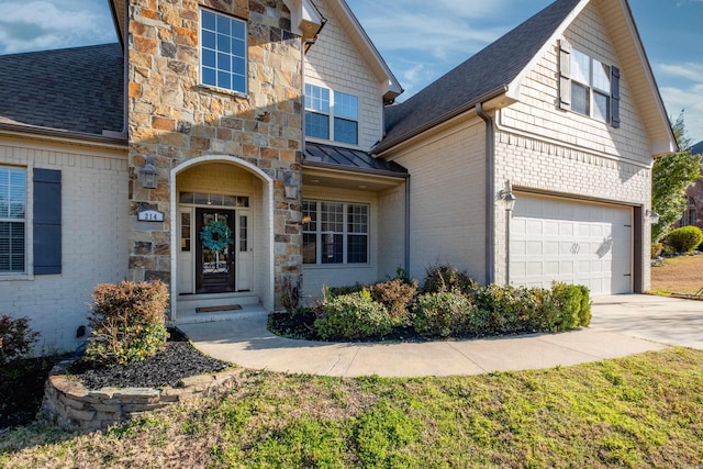 view of front of property with stone siding, roof with shingles, concrete driveway, and an attached garage