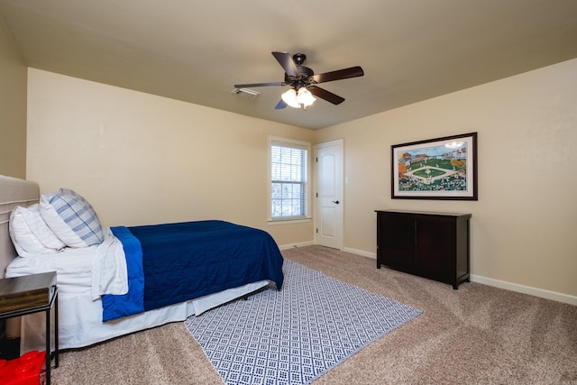 bedroom featuring a ceiling fan, baseboards, and carpet floors