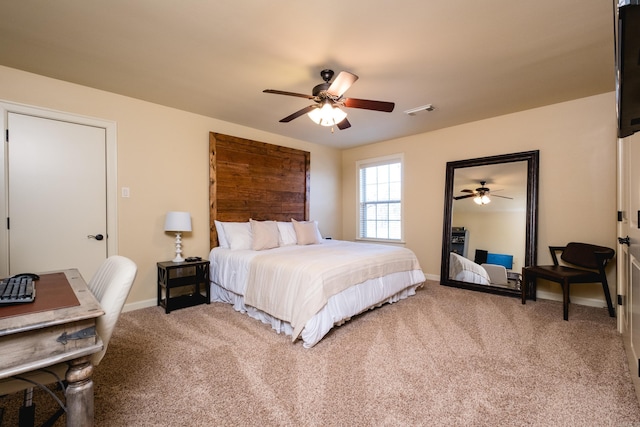 carpeted bedroom with baseboards, visible vents, and ceiling fan