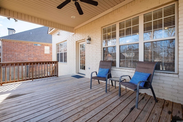 wooden deck featuring a ceiling fan