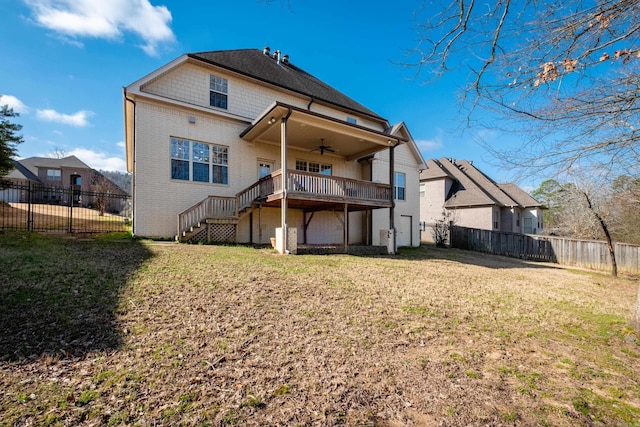 rear view of property with a fenced backyard, stairway, a lawn, and ceiling fan