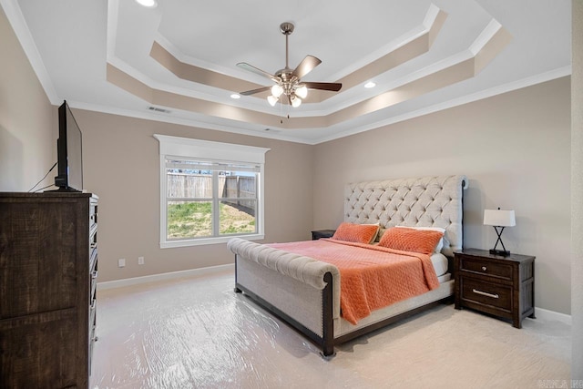 bedroom with visible vents, a raised ceiling, and baseboards