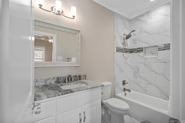 bathroom featuring bathing tub / shower combination, toilet, marble finish floor, and vanity