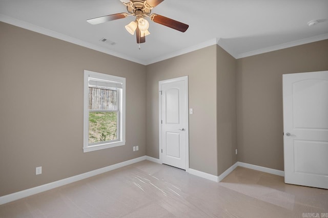 unfurnished bedroom with visible vents, ceiling fan, baseboards, and ornamental molding