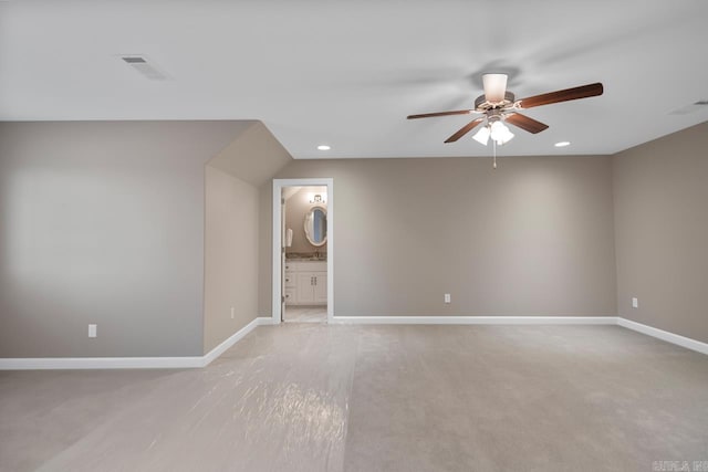 empty room featuring visible vents, baseboards, and ceiling fan