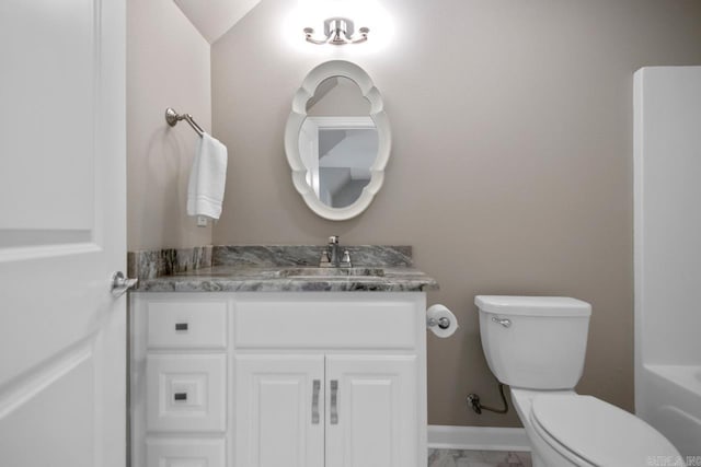 bathroom featuring baseboards, marble finish floor, vanity, and toilet