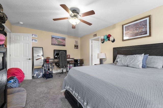 bedroom with a textured ceiling, carpet floors, and ceiling fan