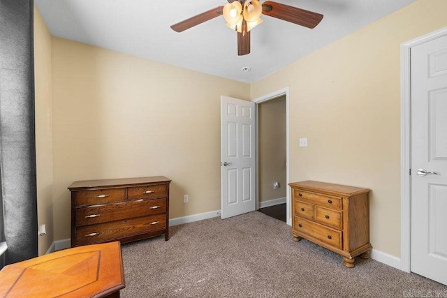 carpeted bedroom with baseboards and a ceiling fan