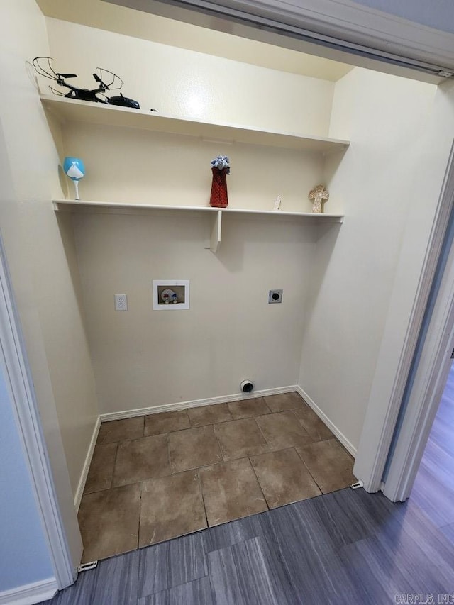 laundry room featuring laundry area, hookup for a washing machine, electric dryer hookup, and baseboards