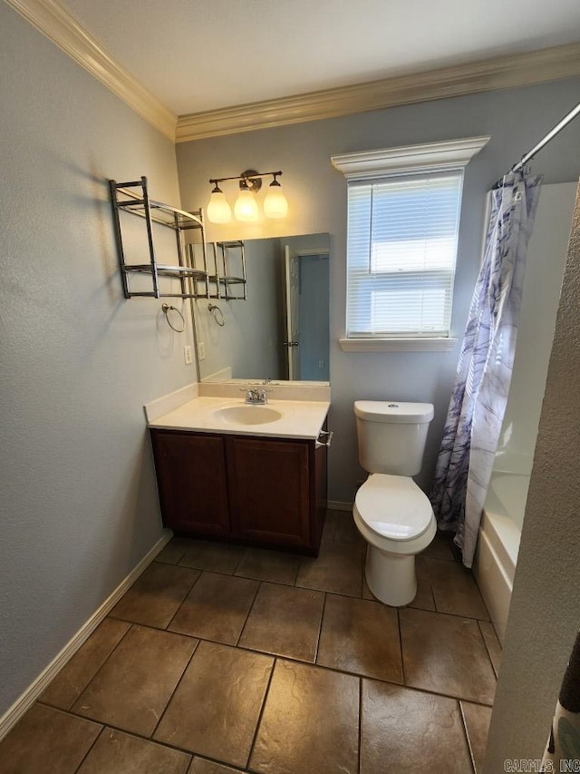 bathroom with tile patterned flooring, crown molding, baseboards, toilet, and vanity