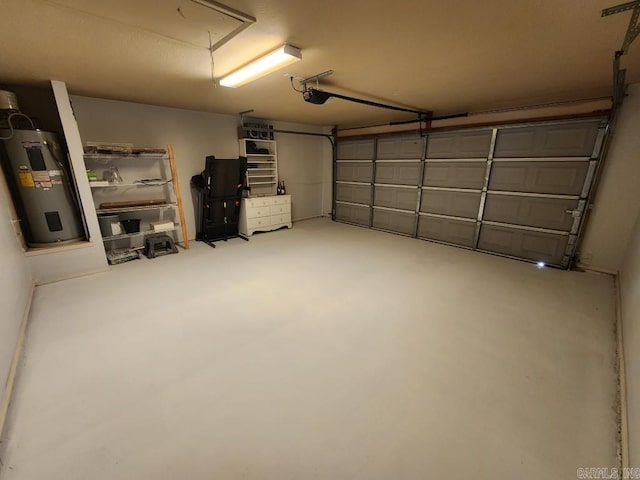 garage featuring a garage door opener and electric water heater