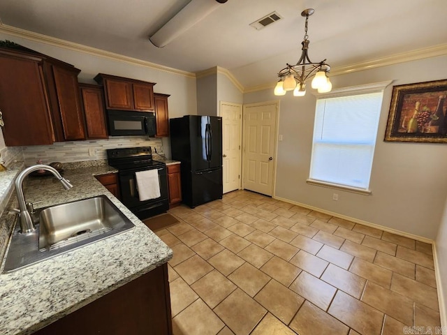 kitchen featuring visible vents, black appliances, a sink, crown molding, and decorative backsplash