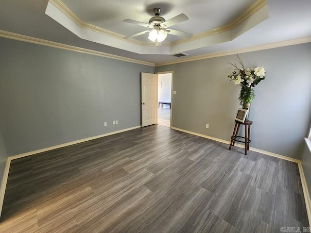 unfurnished room featuring a tray ceiling, ornamental molding, baseboards, and ceiling fan