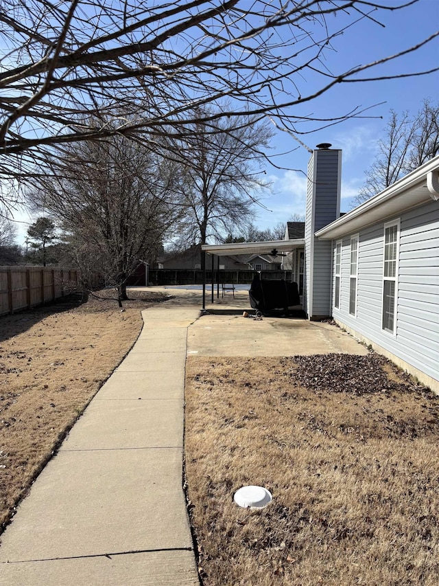 view of yard featuring a patio area and fence