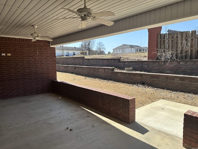 view of patio / terrace featuring a ceiling fan and fence