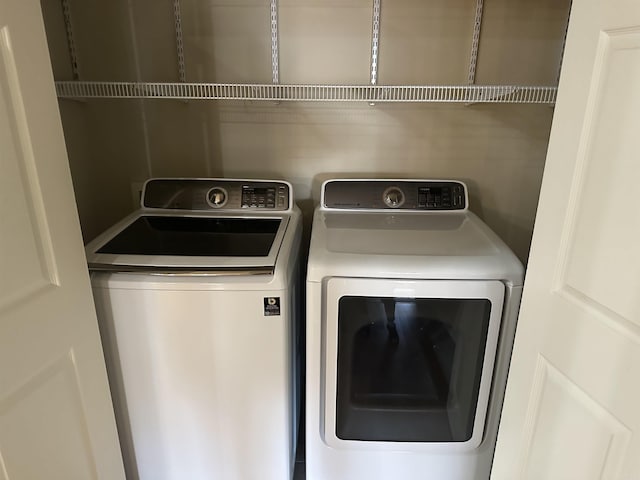 laundry area featuring laundry area and washer and clothes dryer