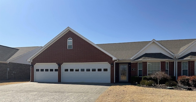 view of front of property with brick siding and driveway