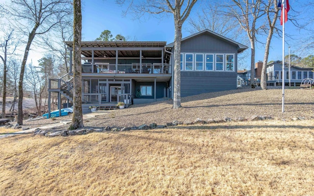 rear view of property with a balcony