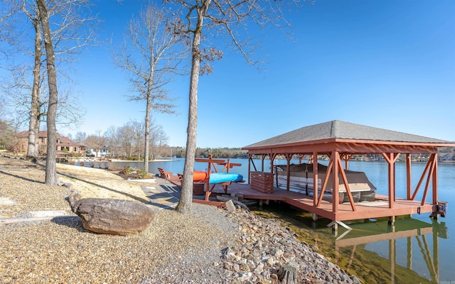 view of dock with boat lift and a water view