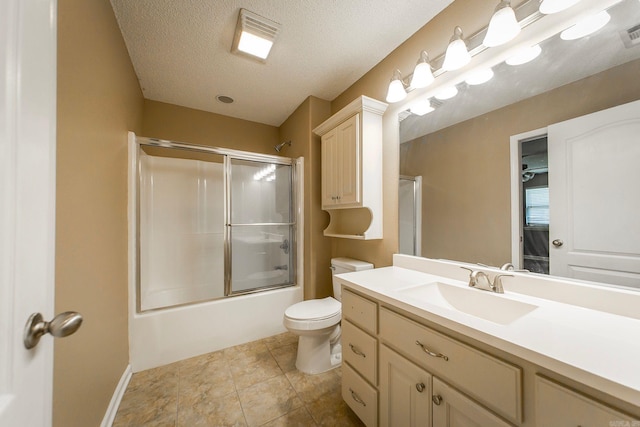 bathroom with visible vents, toilet, a textured ceiling, shower / bath combination with glass door, and vanity