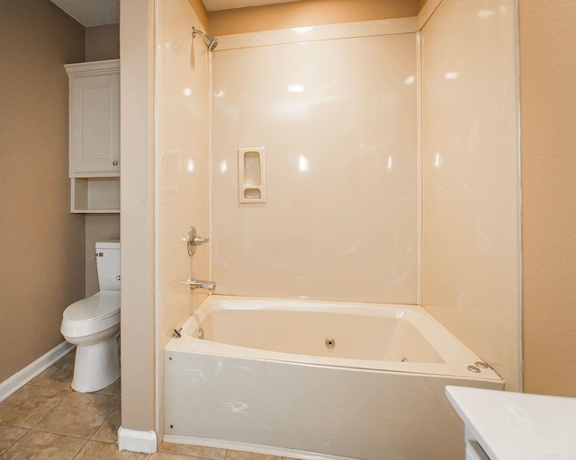 bathroom featuring baseboards, toilet, vanity, and bathtub / shower combination