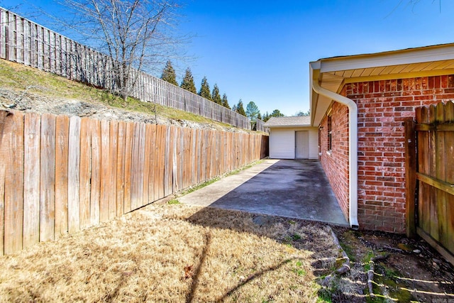 view of yard featuring a patio and a fenced backyard