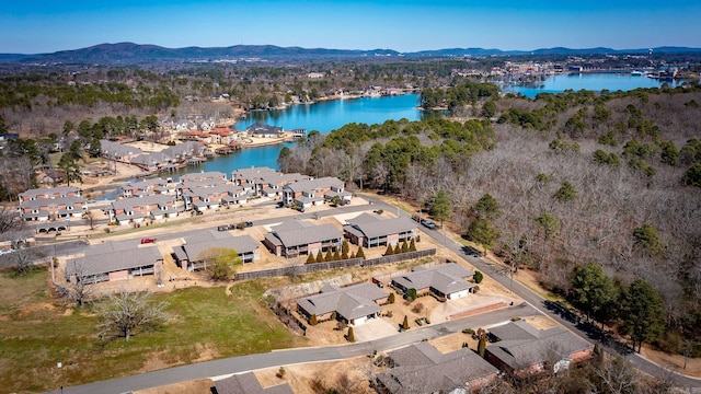 drone / aerial view featuring a residential view and a water and mountain view