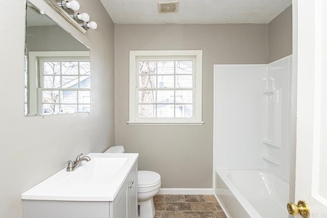 bathroom featuring visible vents, toilet, a textured ceiling, baseboards, and vanity