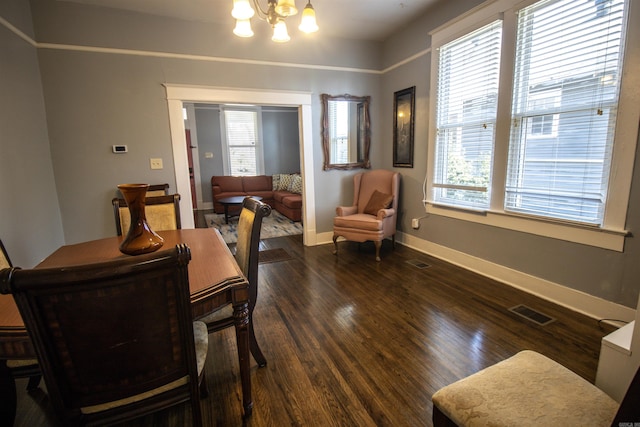 dining area featuring a notable chandelier, visible vents, and plenty of natural light