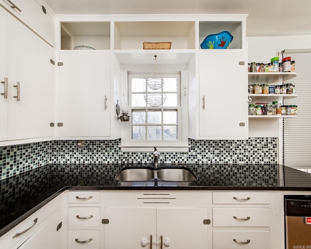 kitchen with open shelves, decorative backsplash, white cabinets, and a sink