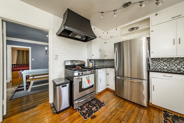 kitchen with custom exhaust hood, dark wood-style floors, dark countertops, and stainless steel appliances