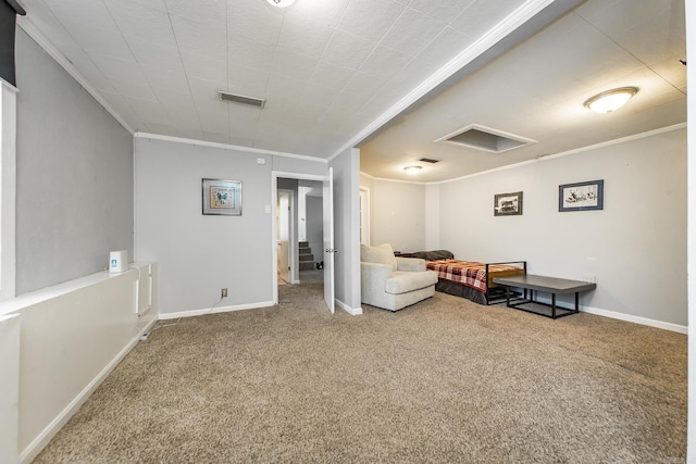 living area featuring visible vents, attic access, crown molding, and carpet floors