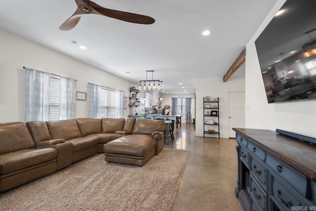 living area with recessed lighting, finished concrete floors, and ceiling fan