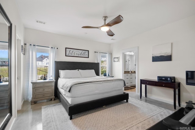 bedroom with visible vents, connected bathroom, baseboards, and a ceiling fan