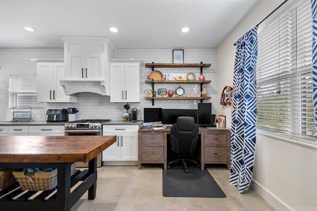 office with recessed lighting and baseboards