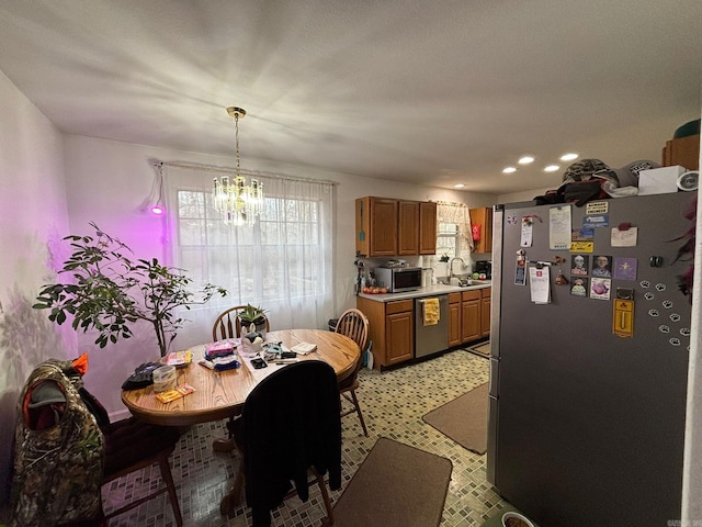 dining room featuring an inviting chandelier and recessed lighting