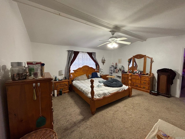 bedroom featuring a ceiling fan, vaulted ceiling with beams, and carpet flooring