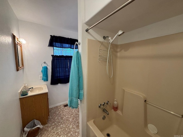 full bath featuring baseboards, shower / tub combination, and vanity