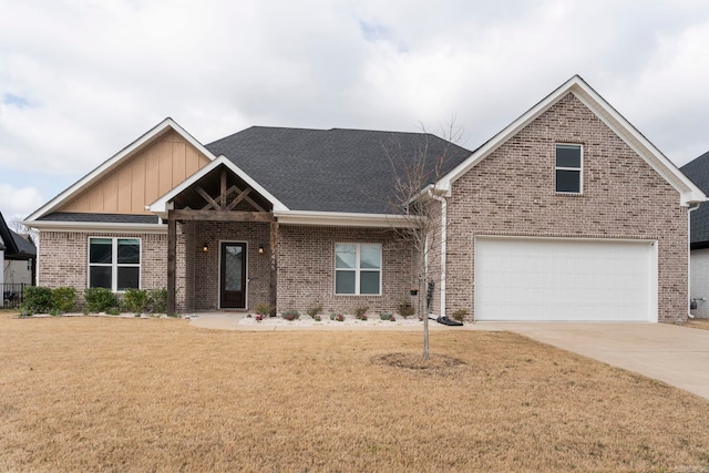 craftsman-style home featuring brick siding, concrete driveway, a front yard, roof with shingles, and a garage