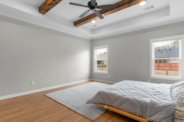 bedroom featuring multiple windows, baseboards, and visible vents