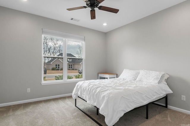 bedroom with a ceiling fan, visible vents, baseboards, carpet floors, and recessed lighting