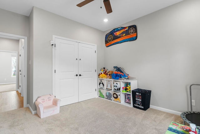 recreation room featuring baseboards, carpet, and ceiling fan